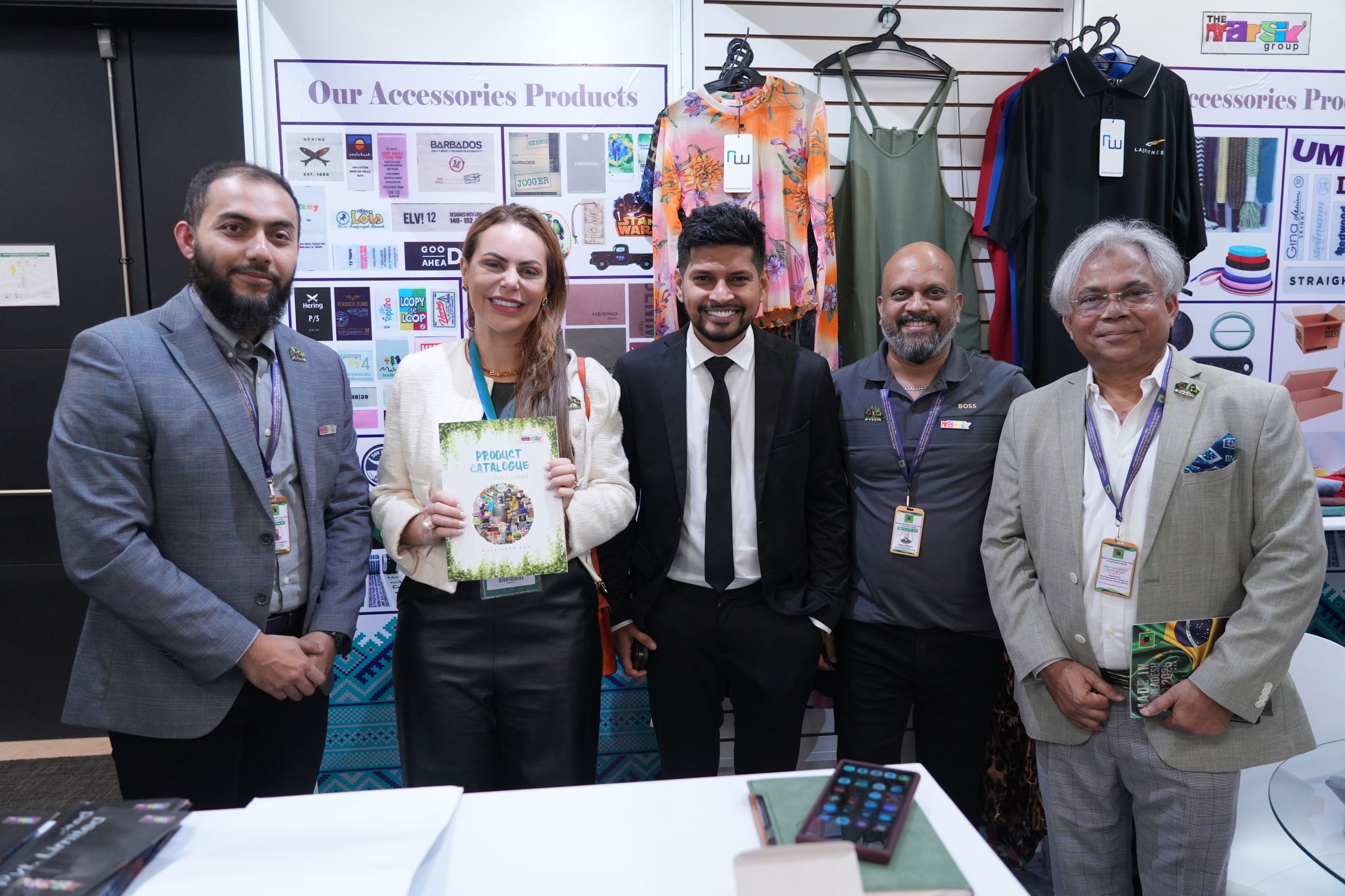 Exhibitors and visitors meeting at an accessories stand in 2025